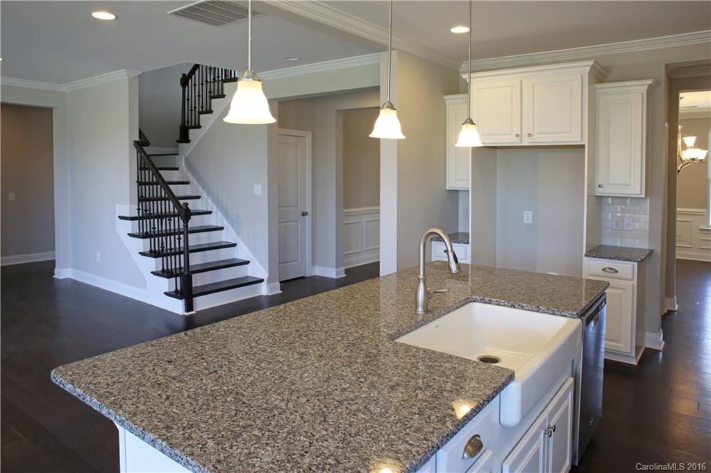 288 Helton Lane, Unit 9 Fort Mill, SC 29708 - Photo 9 of 24 a kitchen with sink refrigerator and stove