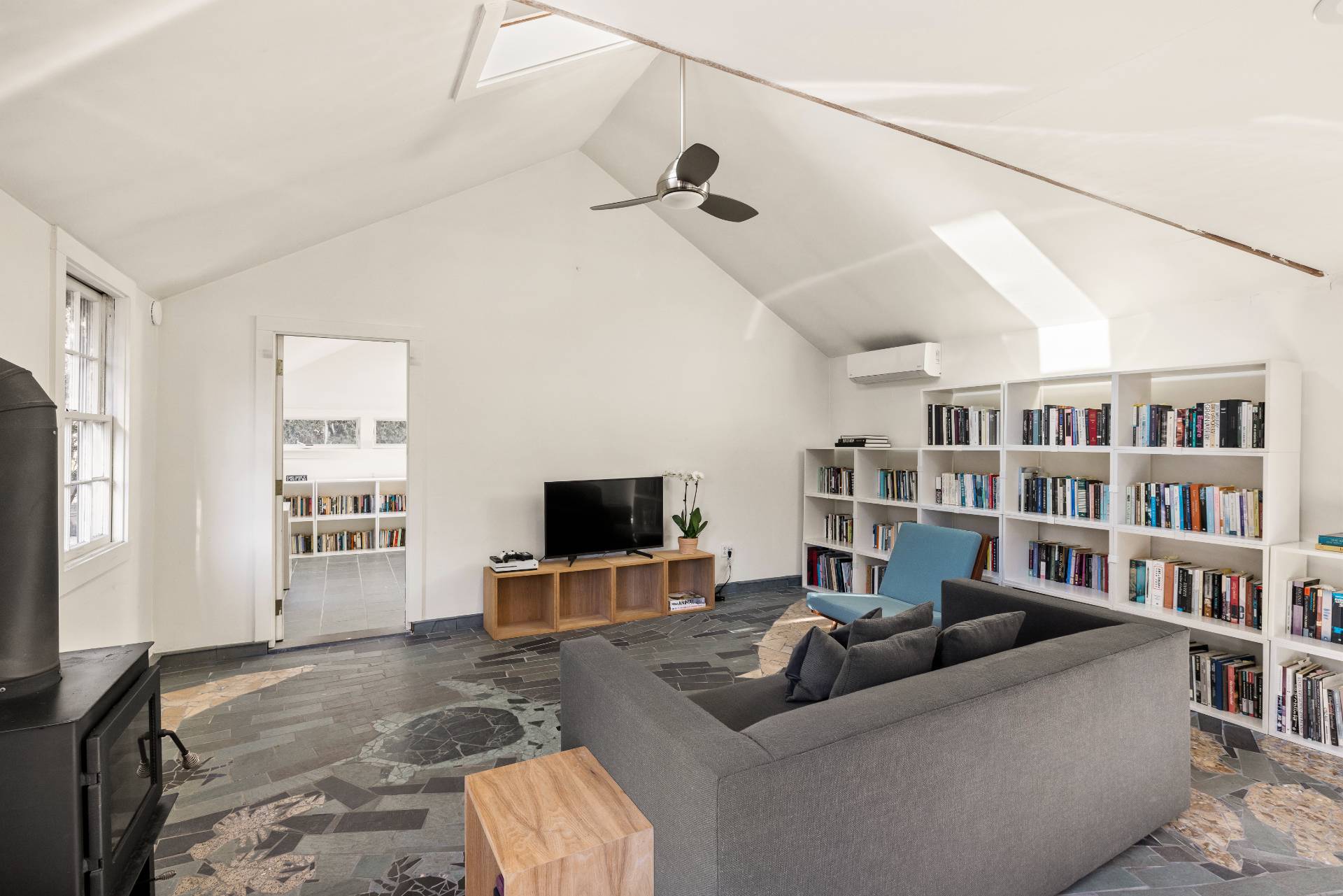 11 Cove Avenue East Sag Harbor, NY 11963 - Photo 12 of 19 a living room with furniture and a flat screen tv