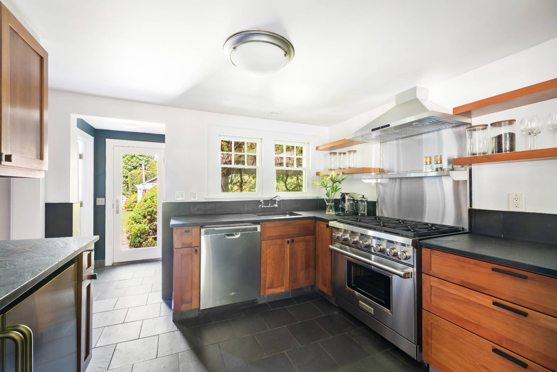 11 Cove Avenue East Sag Harbor, NY 11963 - Photo 6 of 19 a kitchen with stainless steel appliances granite countertop a stove and a sink