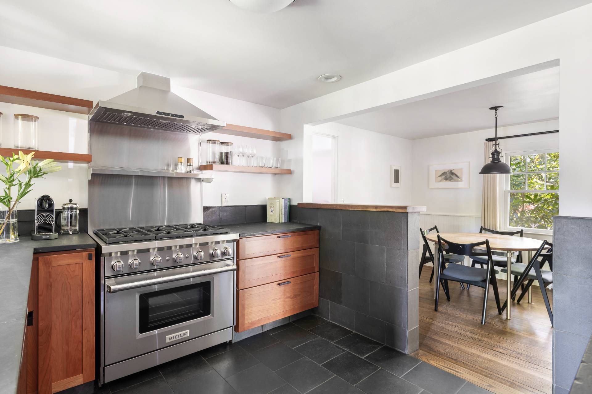 11 Cove Avenue East Sag Harbor, NY 11963 - Photo 7 of 19 a kitchen with a stove a refrigerator and wooden floor