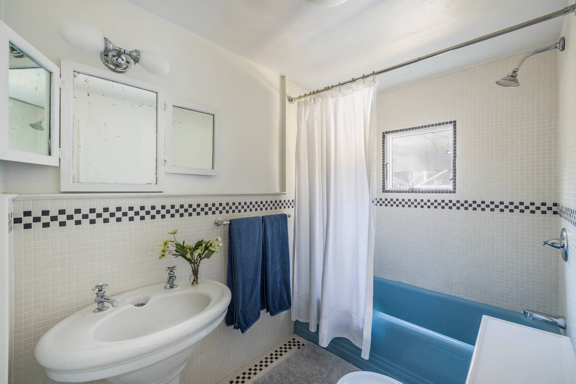 11 Cove Avenue East Sag Harbor, NY 11963 - Photo 10 of 19 a bathroom with a sink and a mirror