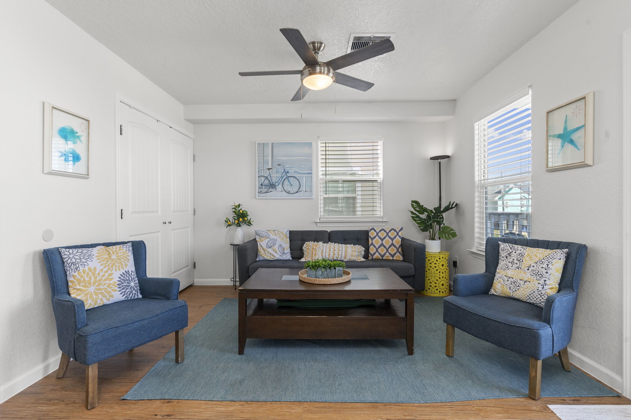 111 Howard Avenue Surfside Beach, TX 77541 - Photo 15 of 33 a living room with furniture and a potted plant