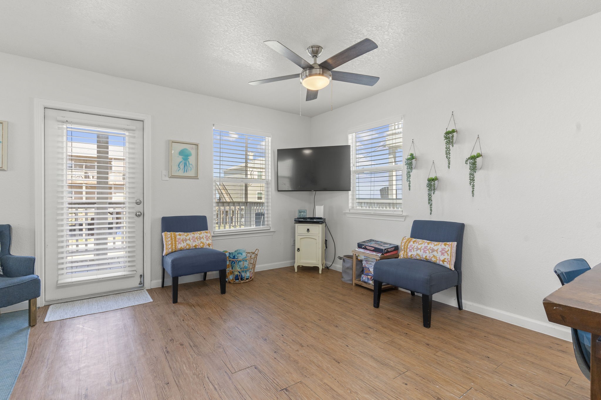 111 Howard Avenue Surfside Beach, TX 77541 - Photo 16 of 33 a living room with furniture and a flat screen tv