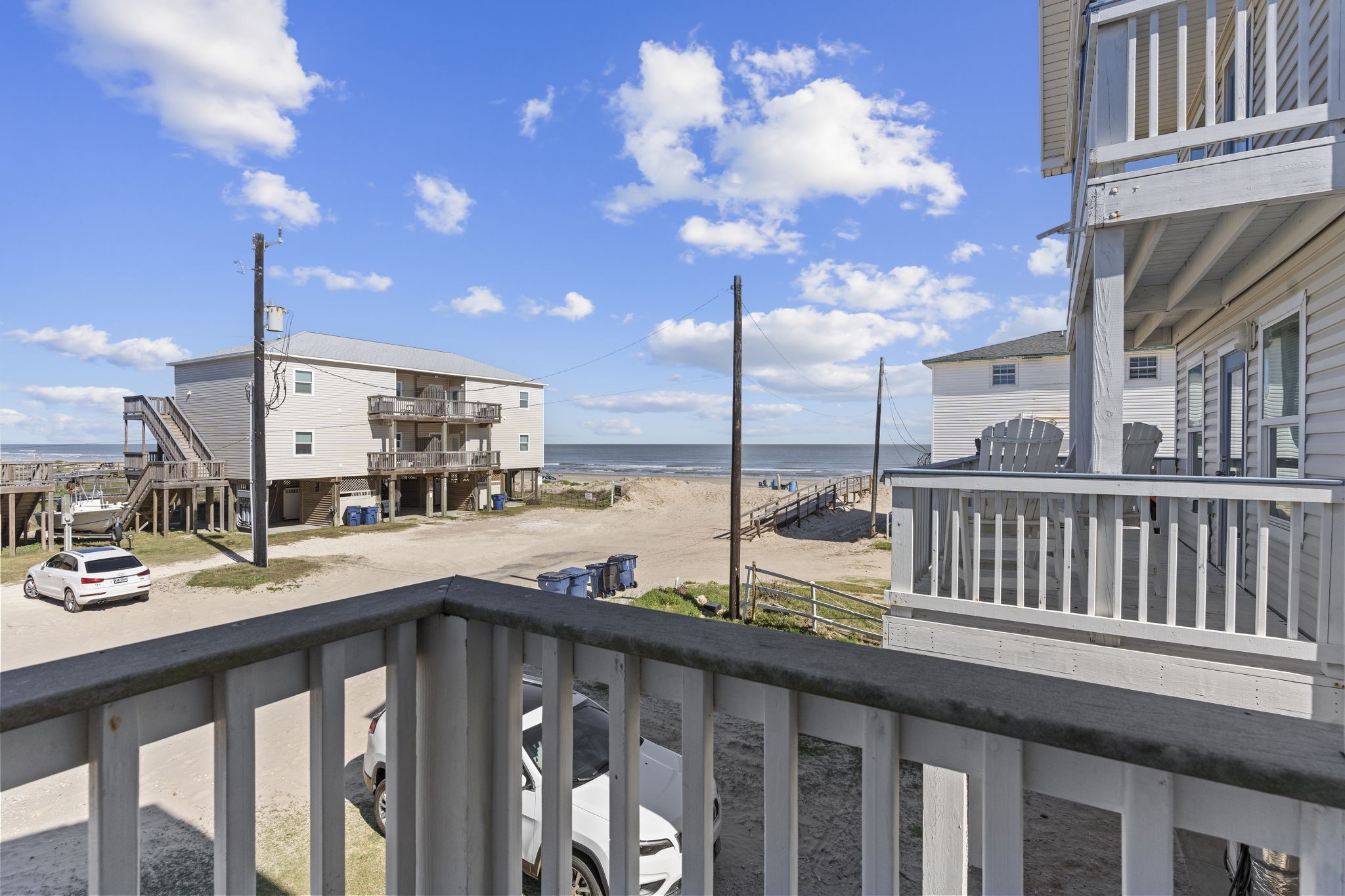 111 Howard Avenue Surfside Beach, TX 77541 - Photo 23 of 33 a view of a balcony with furniture and stove
