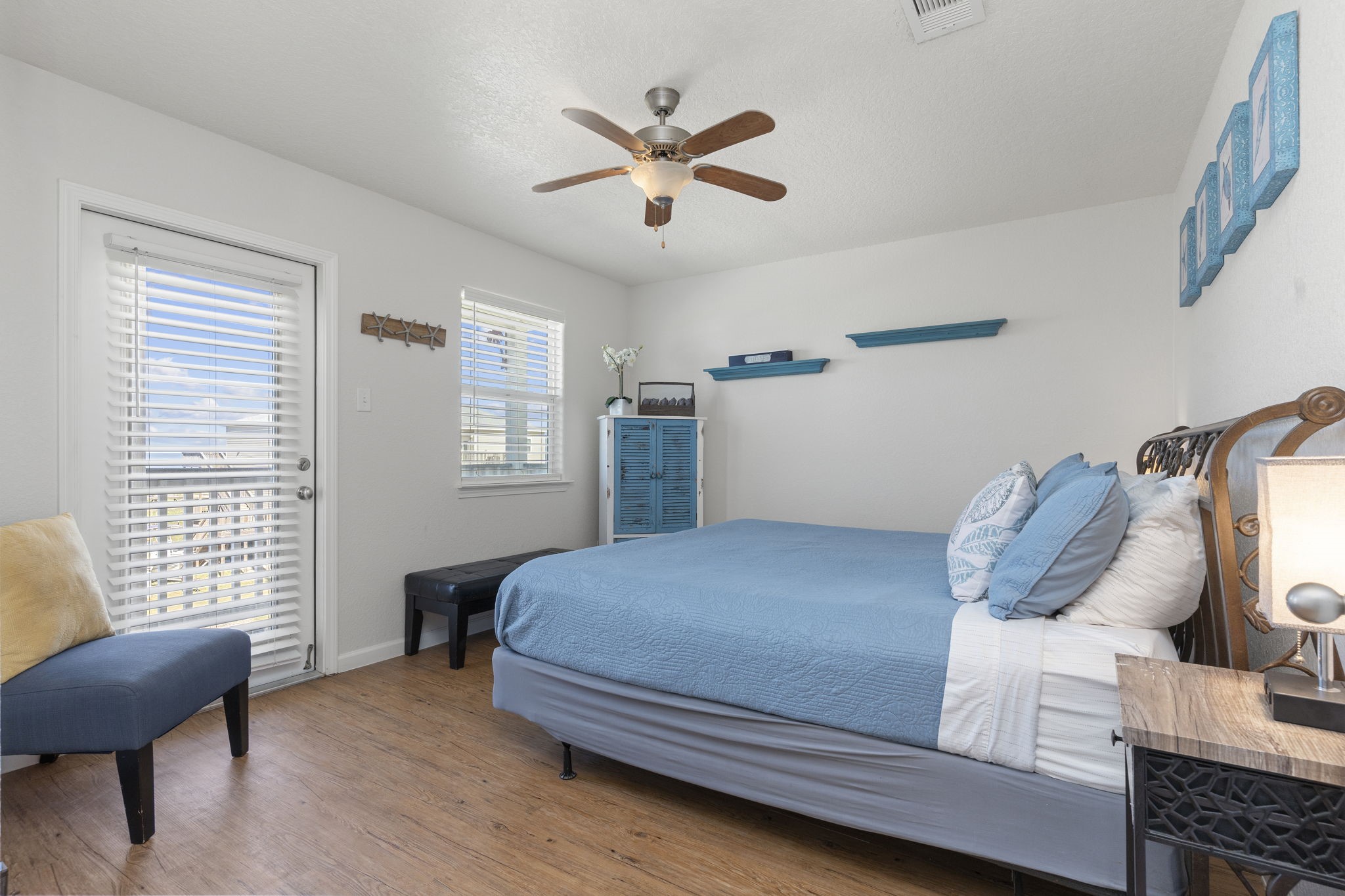 111 Howard Avenue Surfside Beach, TX 77541 - Photo 27 of 33 a bedroom with a bed and window