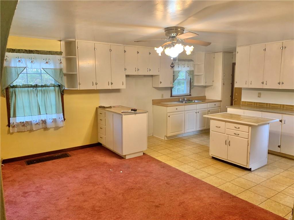 448 Ridge Church Road Amity, PA 15311 - Photo 2 of 24 a kitchen with a stove a sink and a refrigerator