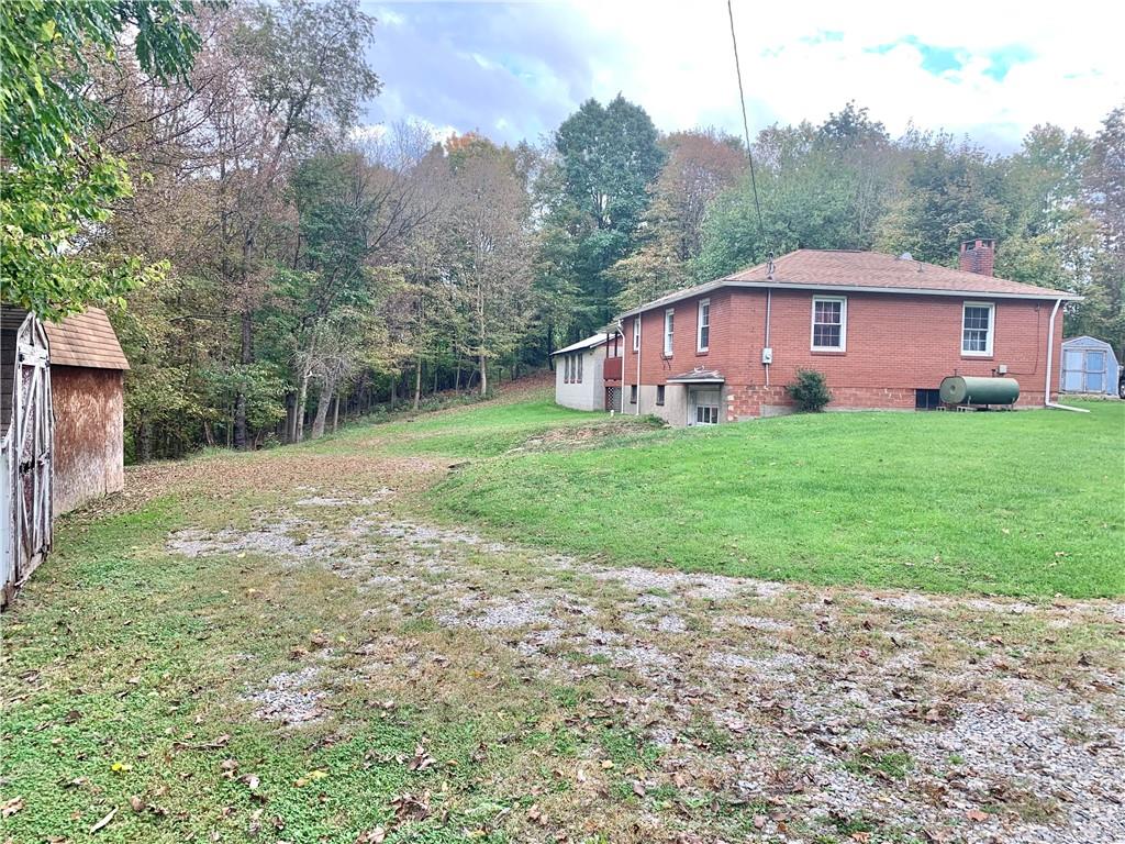 448 Ridge Church Road Amity, PA 15311 - Photo 16 of 24 a view of a yard in front of a house with large trees