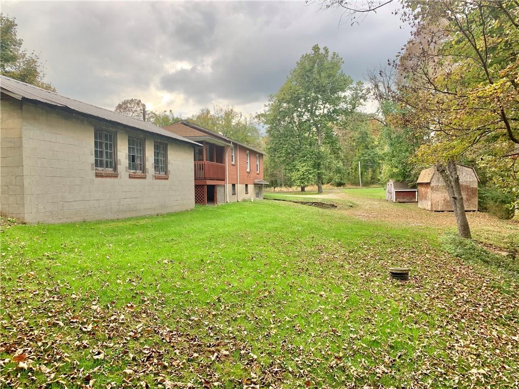 448 Ridge Church Road Amity, PA 15311 - Photo 17 of 24 a backyard of a house with lots of green space and garden view