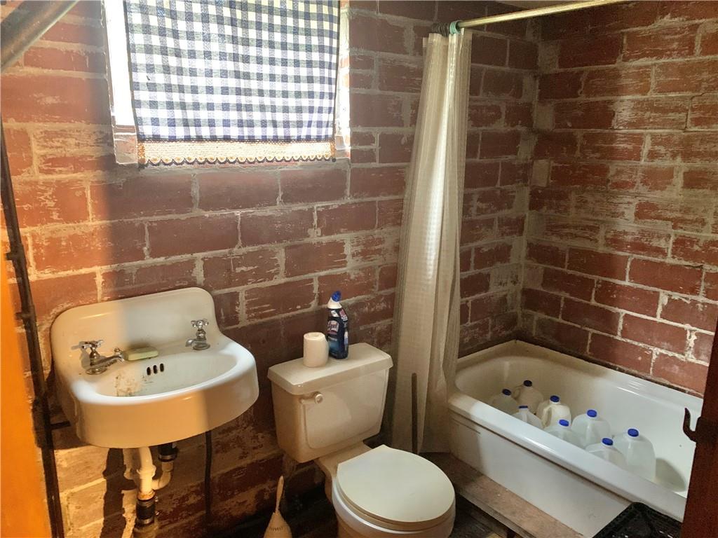 448 Ridge Church Road Amity, PA 15311 - Photo 10 of 24 a bathroom with a sink a toilet and bathtub