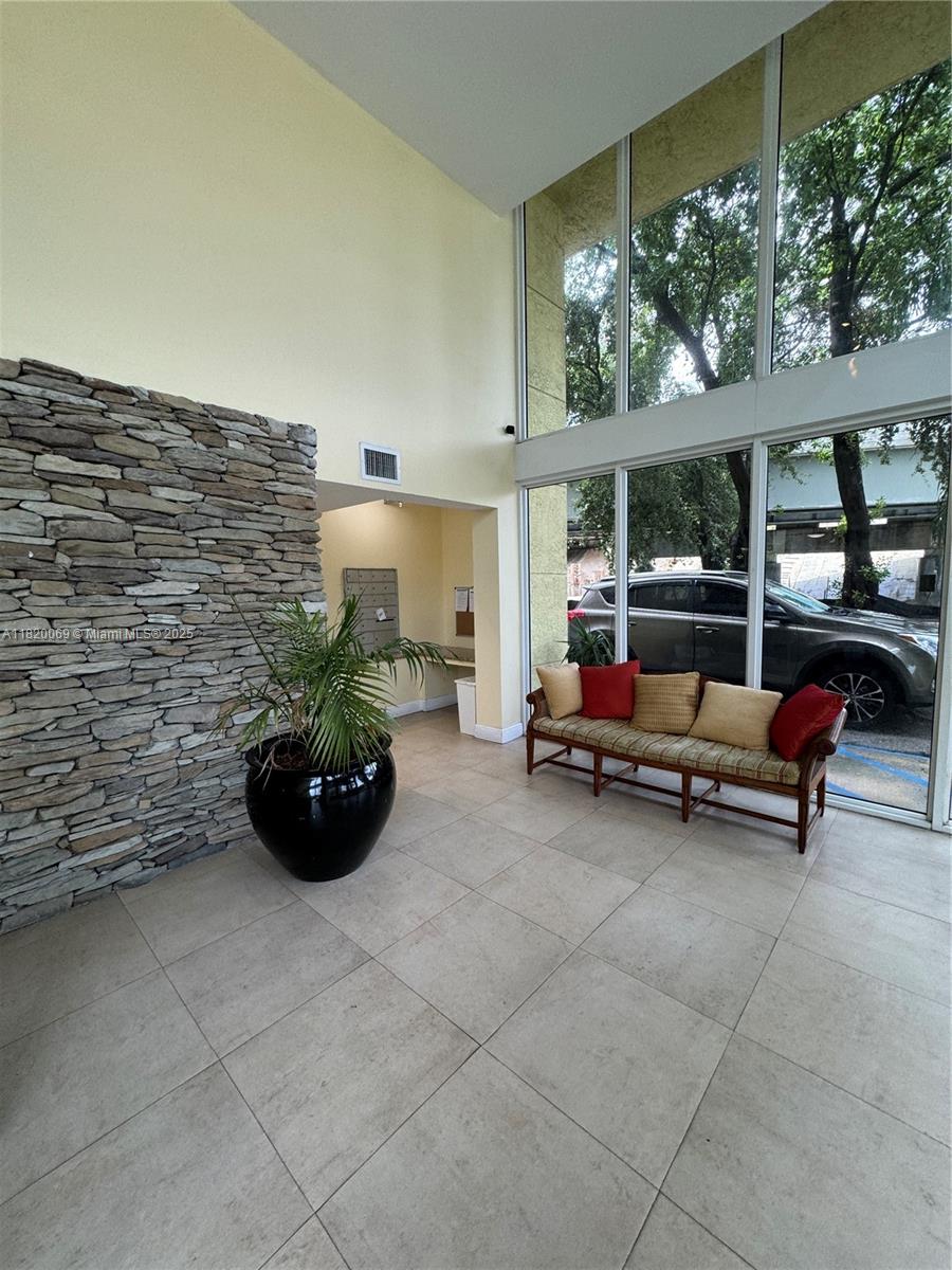 1350 Northwest 8th Court, Unit B35 Miami, FL 33136 - Photo 15 of 22 a balcony with furniture and potted plants