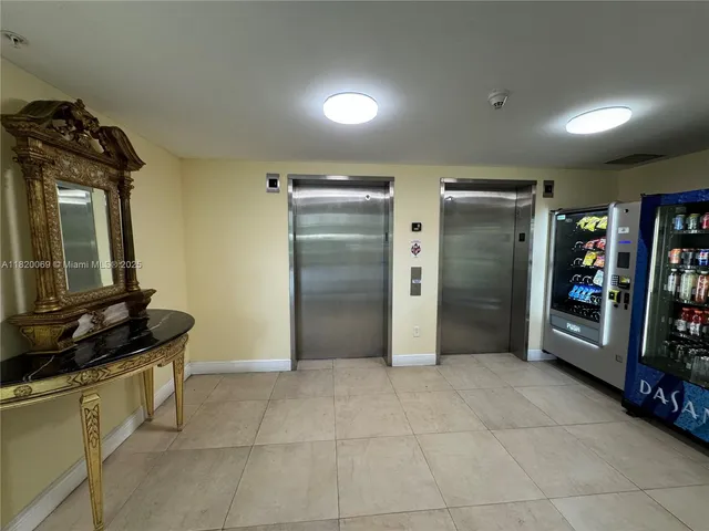 a view of a refrigerator and storage in a room