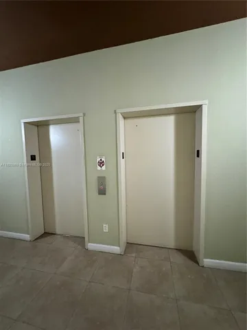 an empty room with closet area