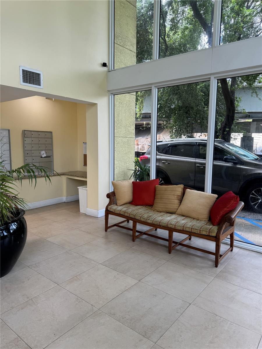 1350 Northwest 8th Court, Unit B35 Miami, FL 33136 - Photo 19 of 22 a outdoor living space with furniture and a potted plant
