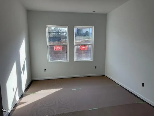 a view of an empty room and a window