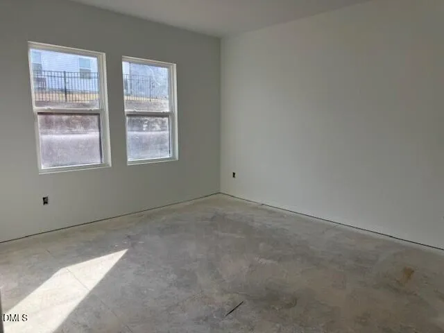 a view of a storage and utility room with a hallway