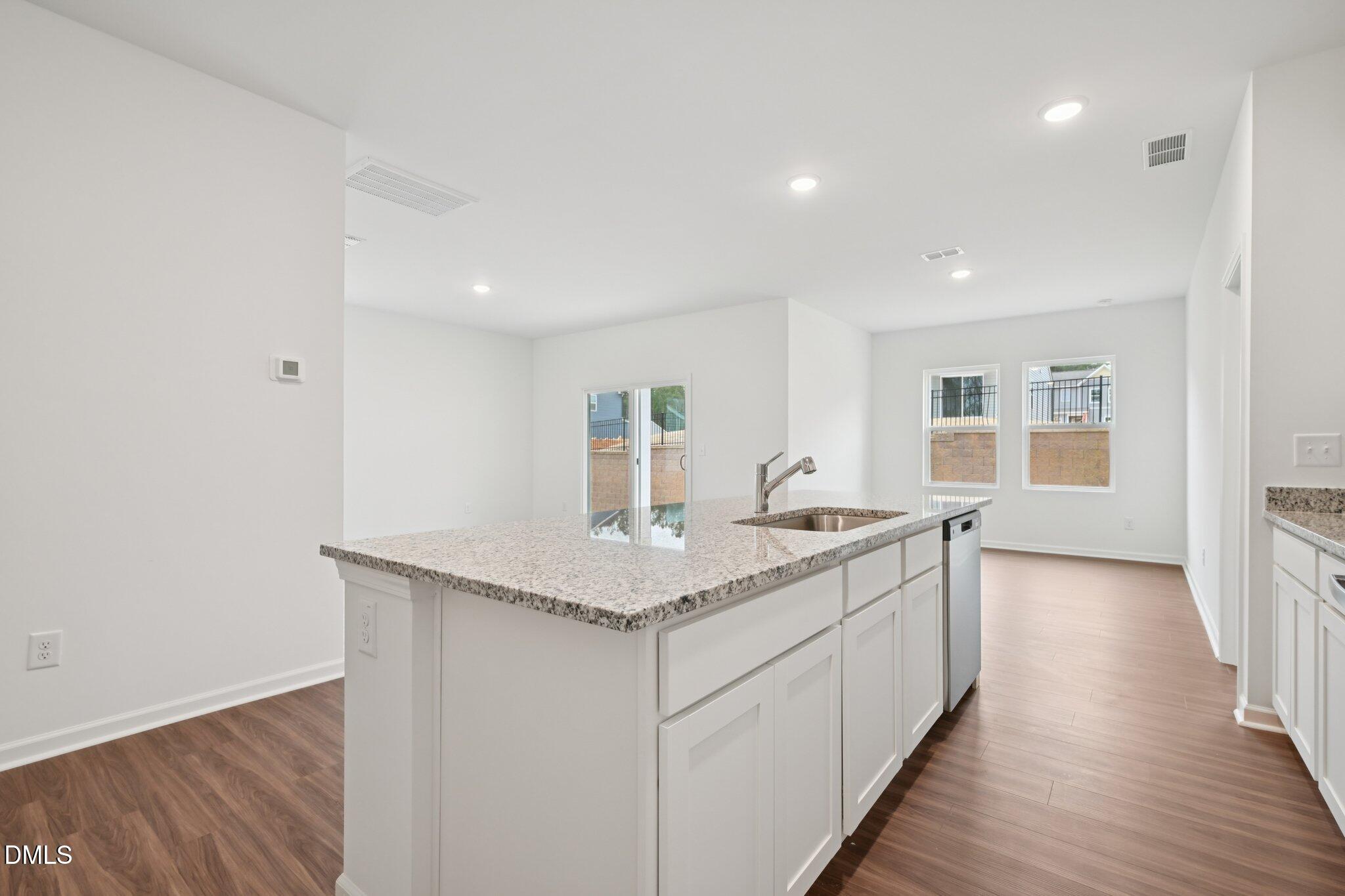 11210 Salers Loop Middlesex, NC 27557 - Photo 23 of 53 a view of a kitchen counter space with wooden floor