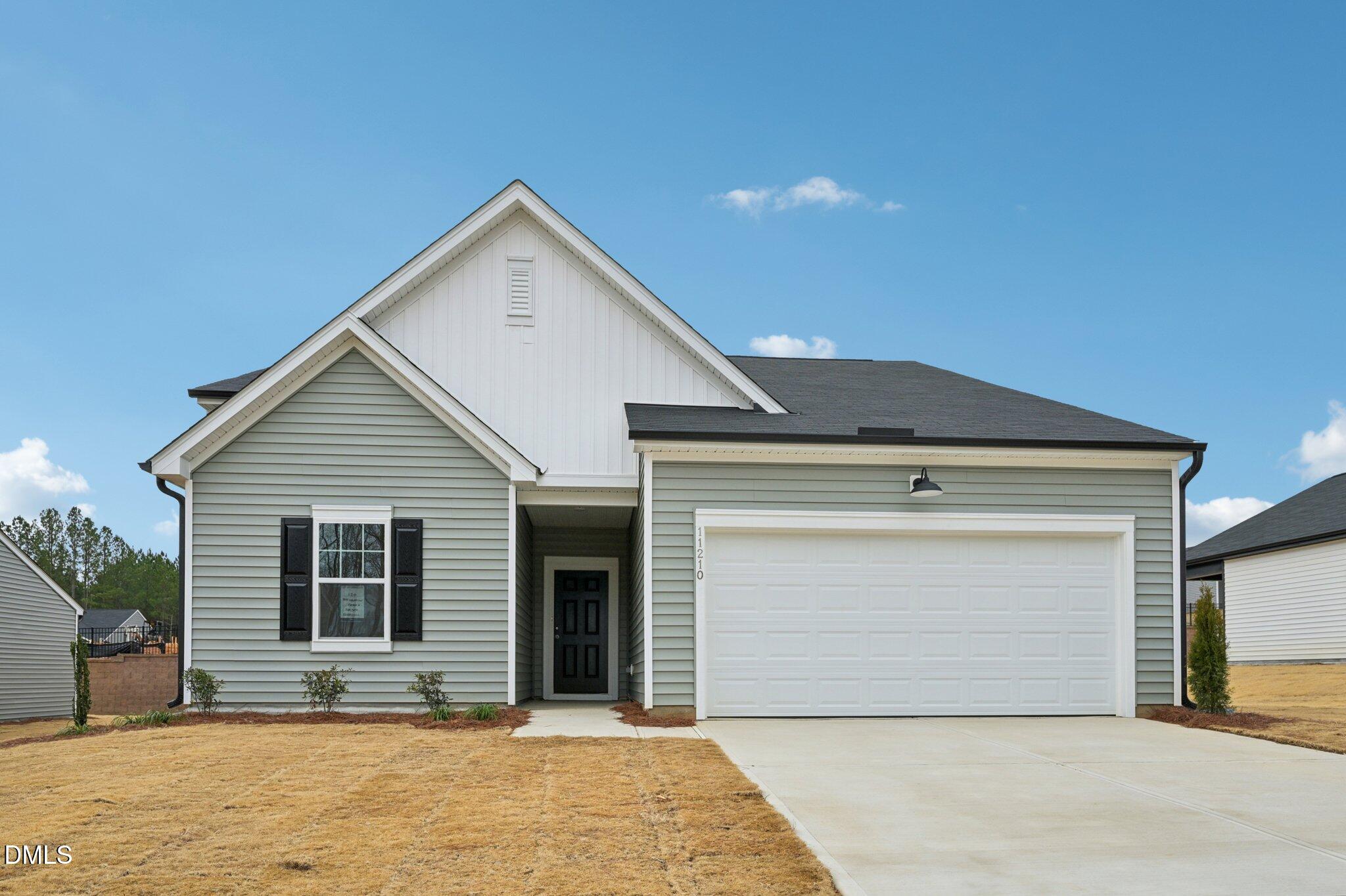11210 Salers Loop Middlesex, NC 27557 - Photo 3 of 53 a front view of a house with yard