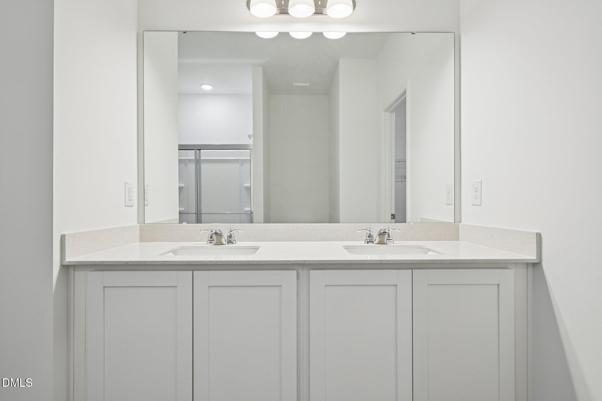 11210 Salers Loop Middlesex, NC 27557 - Photo 32 of 53 a bathroom with a sink and a mirror
