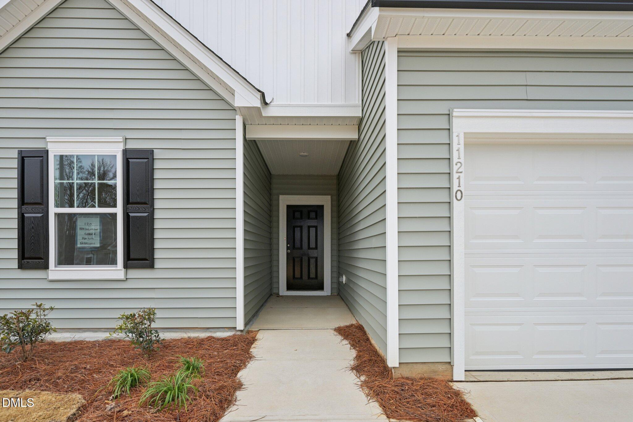 11210 Salers Loop Middlesex, NC 27557 - Photo 5 of 53 a view of a house with a door and a window