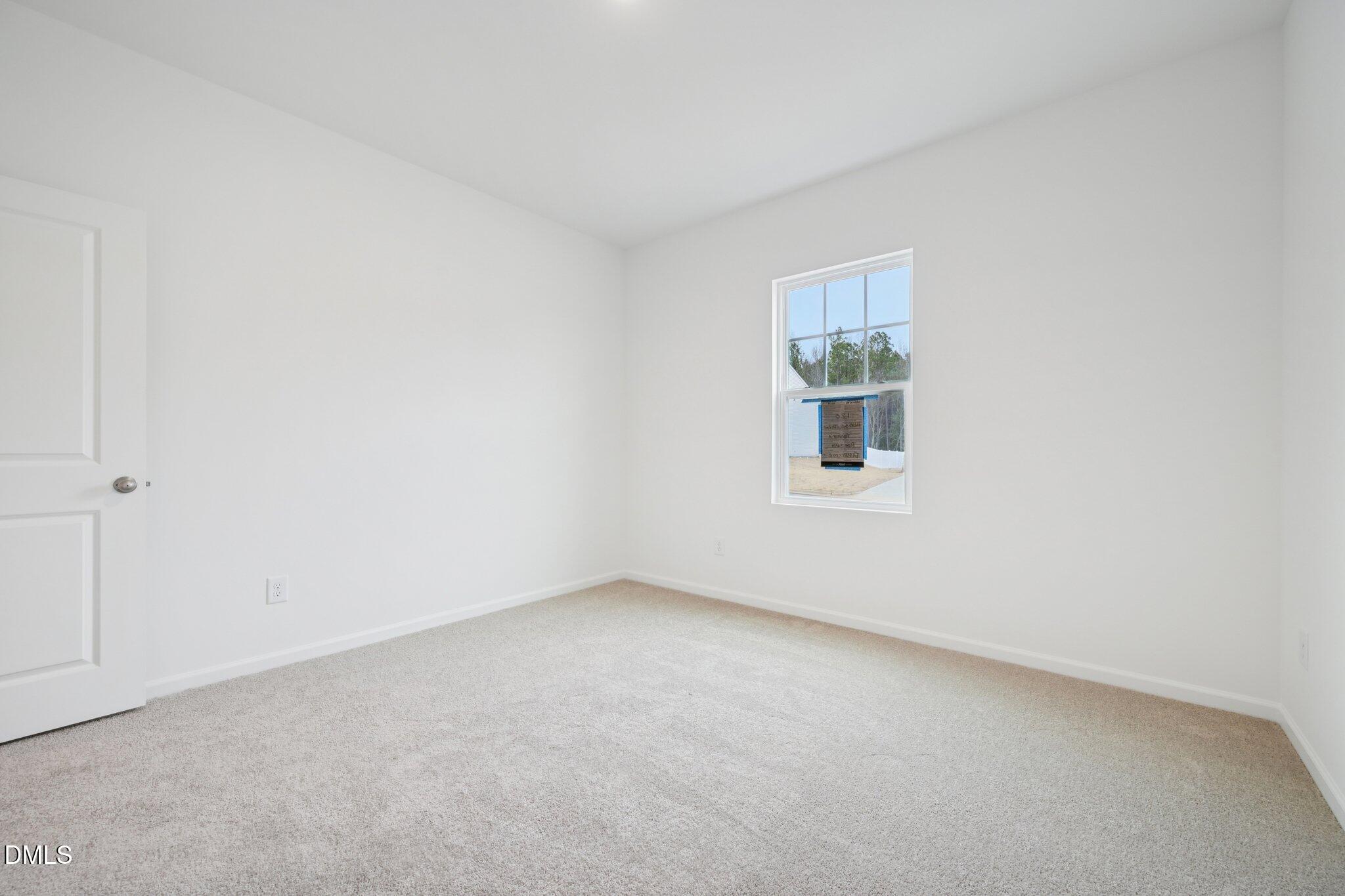 11210 Salers Loop Middlesex, NC 27557 - Photo 10 of 53 a view of an empty room with a window