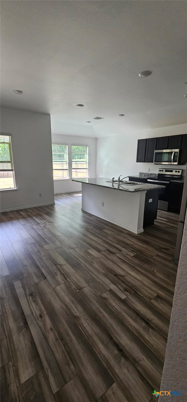 2513 Rollett Drive Temple, TX 76504 - Photo 2 of 6 a view of a kitchen with wooden floor and stainless steel appliances