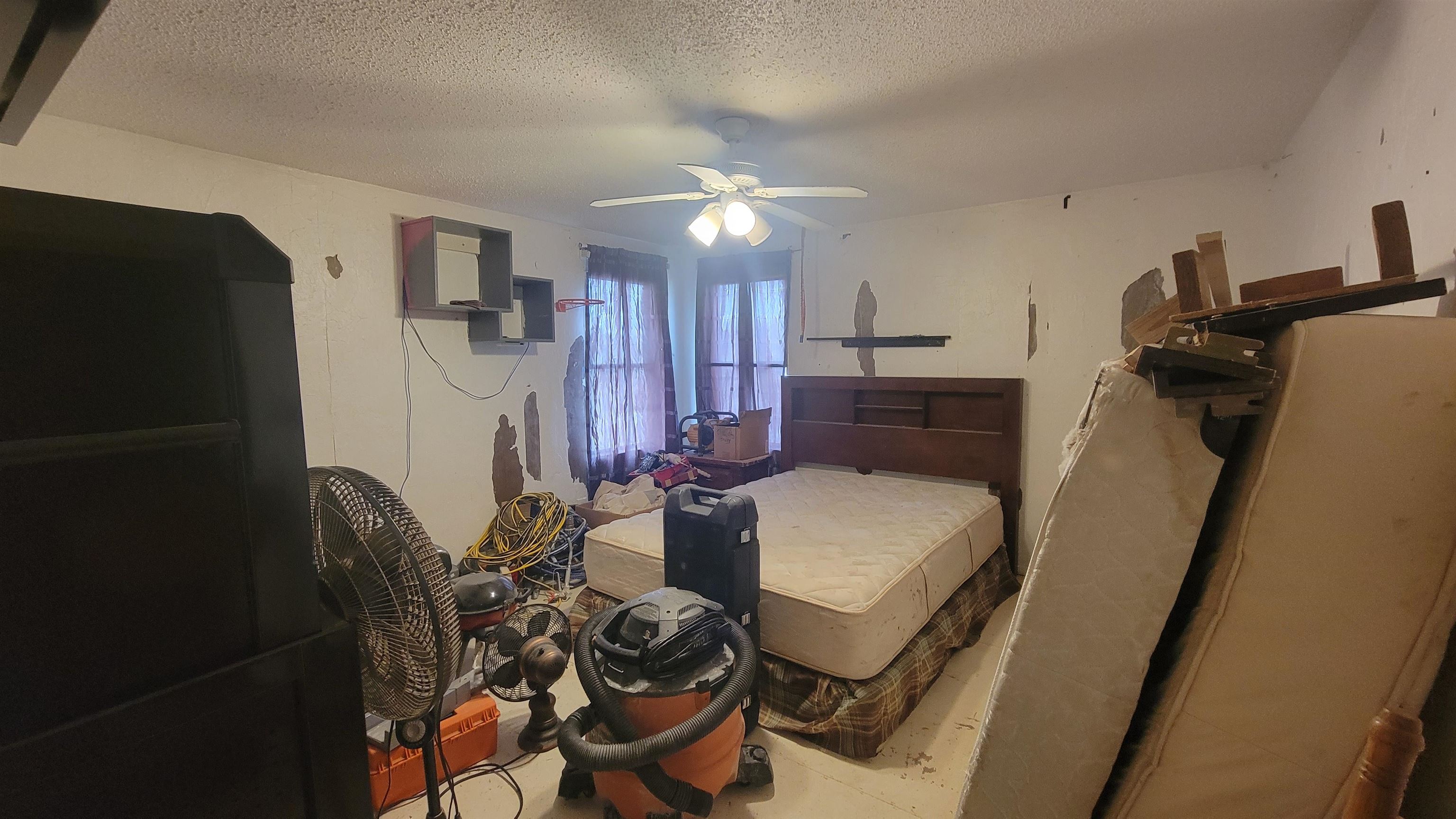 1844 M Road Fruita, CO 81521 - Photo 29 of 32 a bedroom with furniture and a chandelier