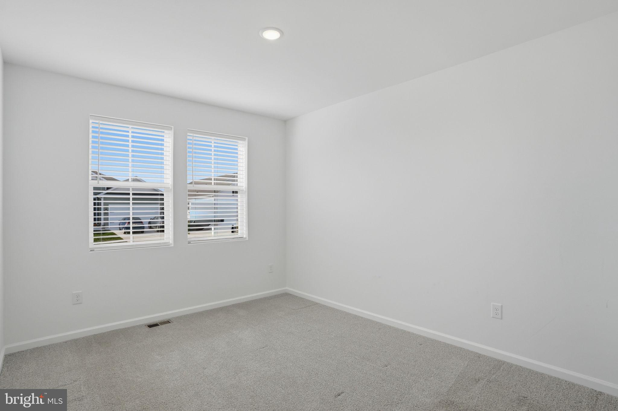 23402 Buttonbush Way Millville, DE 19967 - Photo 11 of 52 an empty room with a window