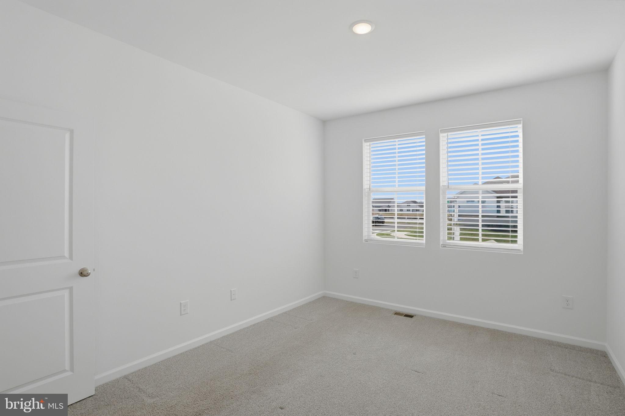 23402 Buttonbush Way Millville, DE 19967 - Photo 12 of 52 an empty room with a window