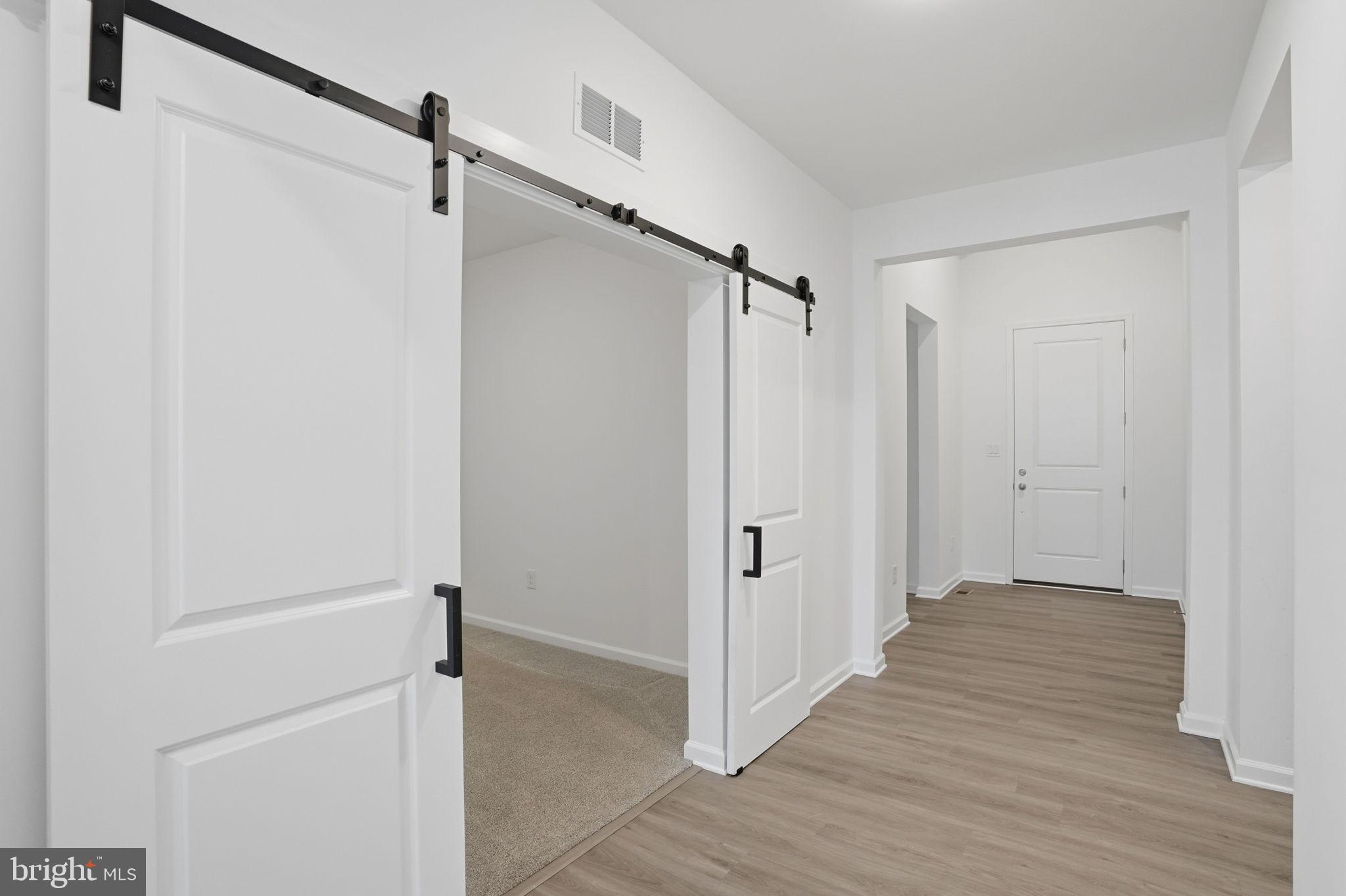 23402 Buttonbush Way Millville, DE 19967 - Photo 22 of 52 a view of a room with wooden floor