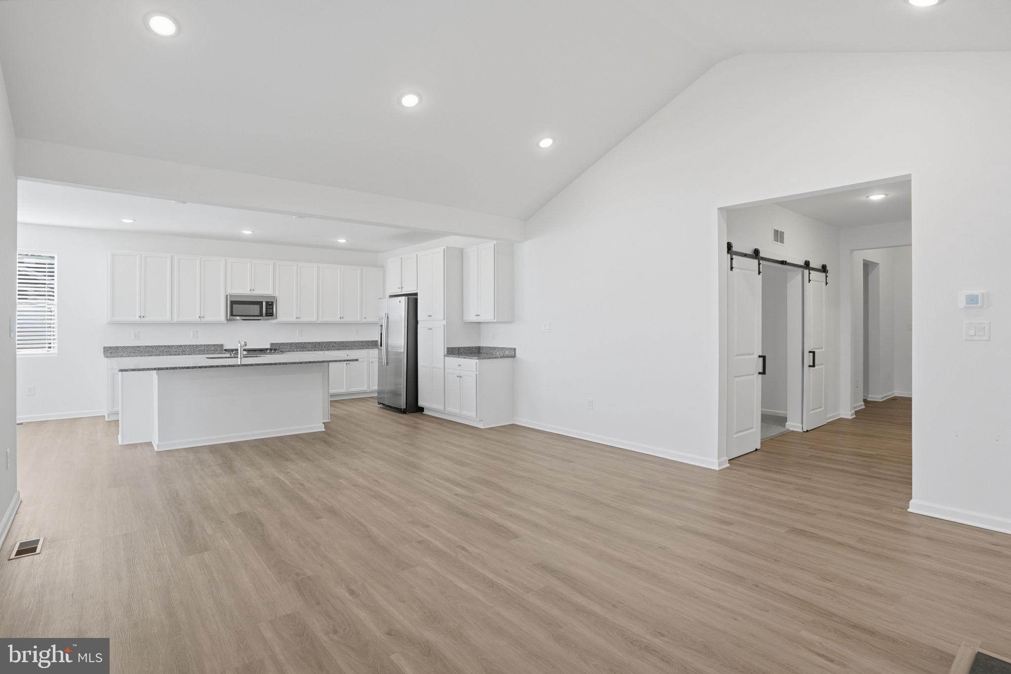 23402 Buttonbush Way Millville, DE 19967 - Photo 26 of 52 a view of kitchen with wooden floor