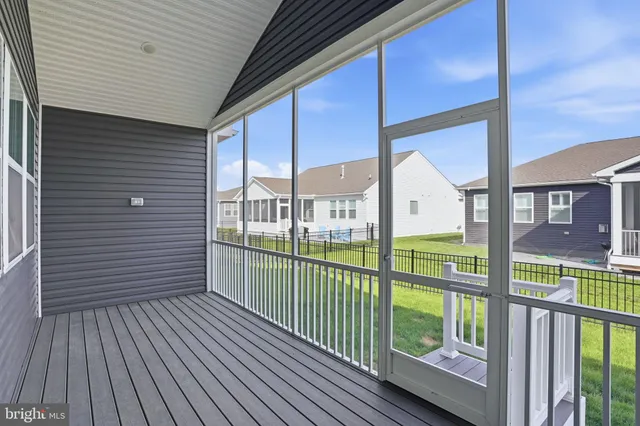 a view of balcony with wooden floor