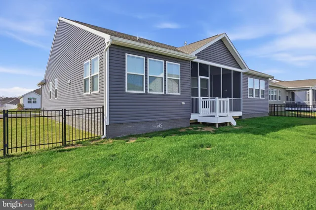 an aerial view of residential houses with outdoor space and swimming pool