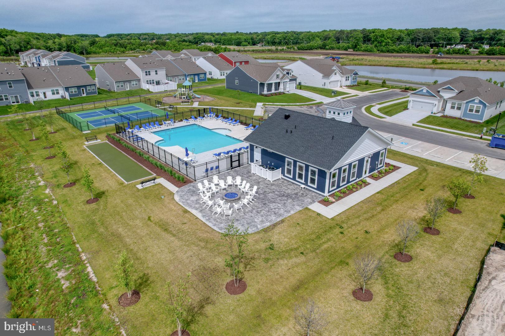 23402 Buttonbush Way Millville, DE 19967 - Photo 49 of 52 an aerial view of residential houses with outdoor space and swimming pool