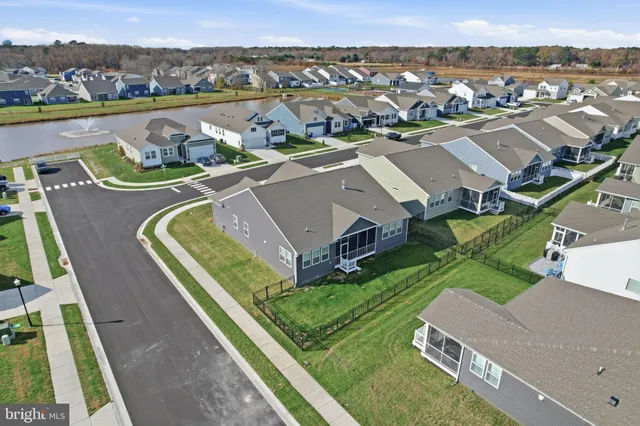 an aerial view of a house with a big yard