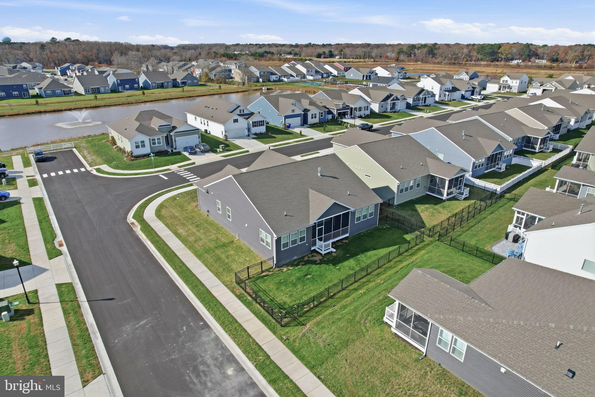 23402 Buttonbush Way Millville, DE 19967 - Photo 5 of 52 an aerial view of a house with a big yard