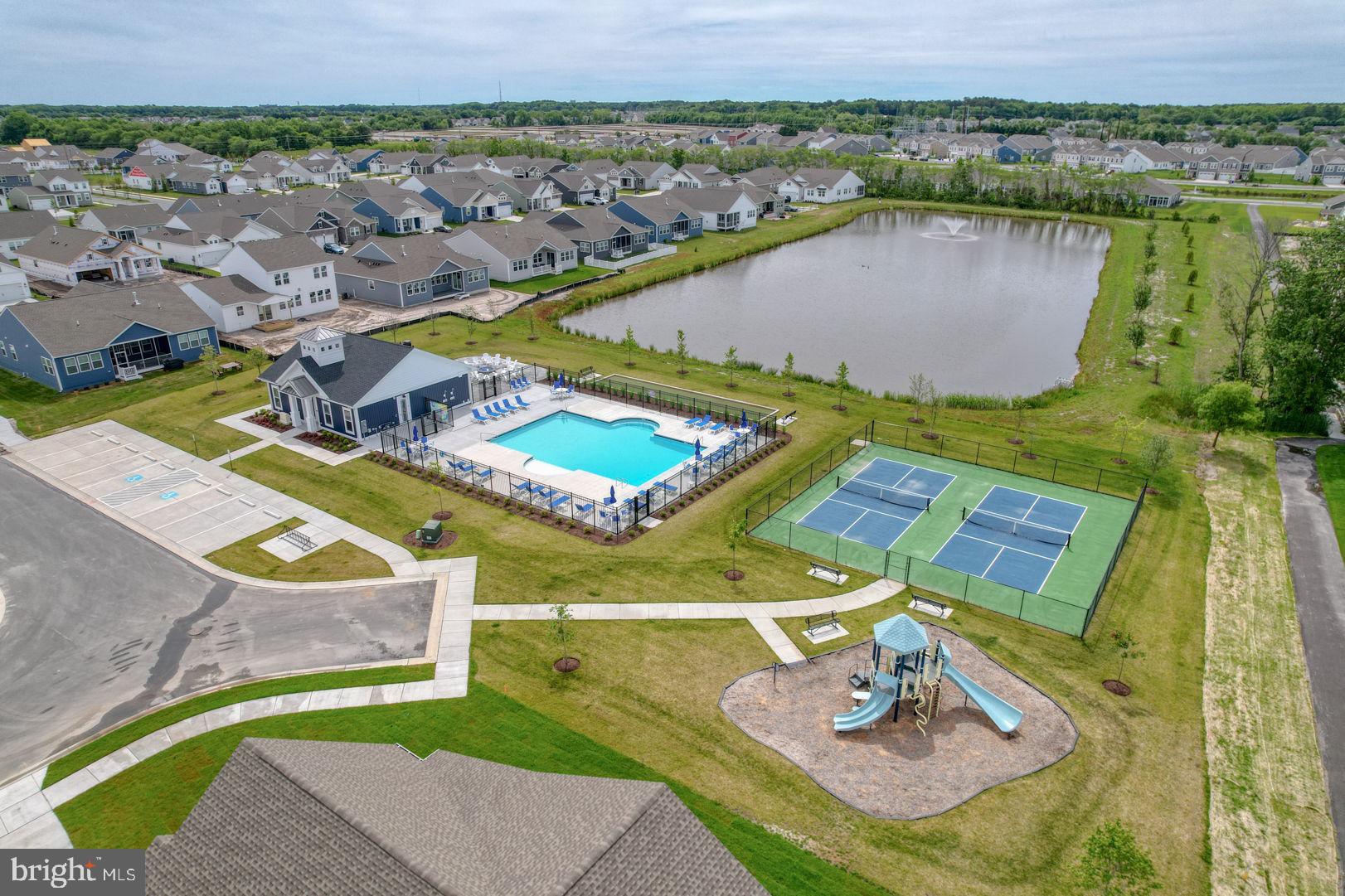 23402 Buttonbush Way Millville, DE 19967 - Photo 52 of 52 an aerial view of residential houses with outdoor space and swimming pool