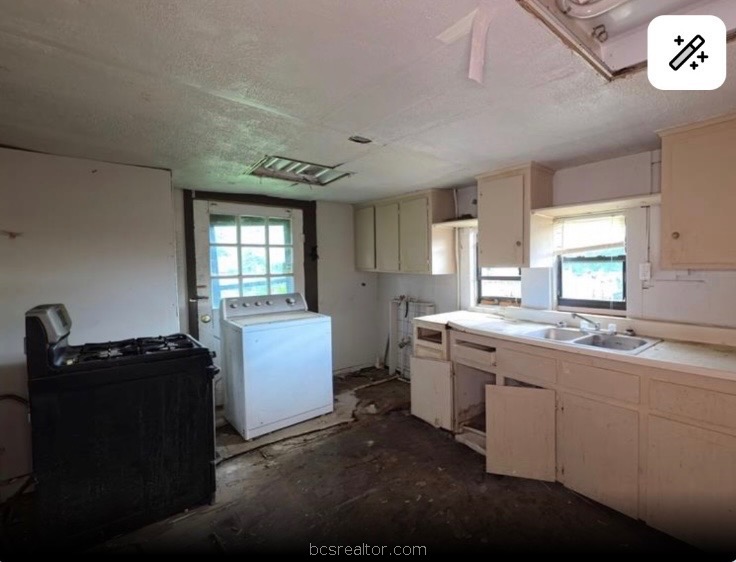 1203 Boulevard Street Bryan, TX 77803 - Photo 12 of 16 a kitchen with a sink and cabinets