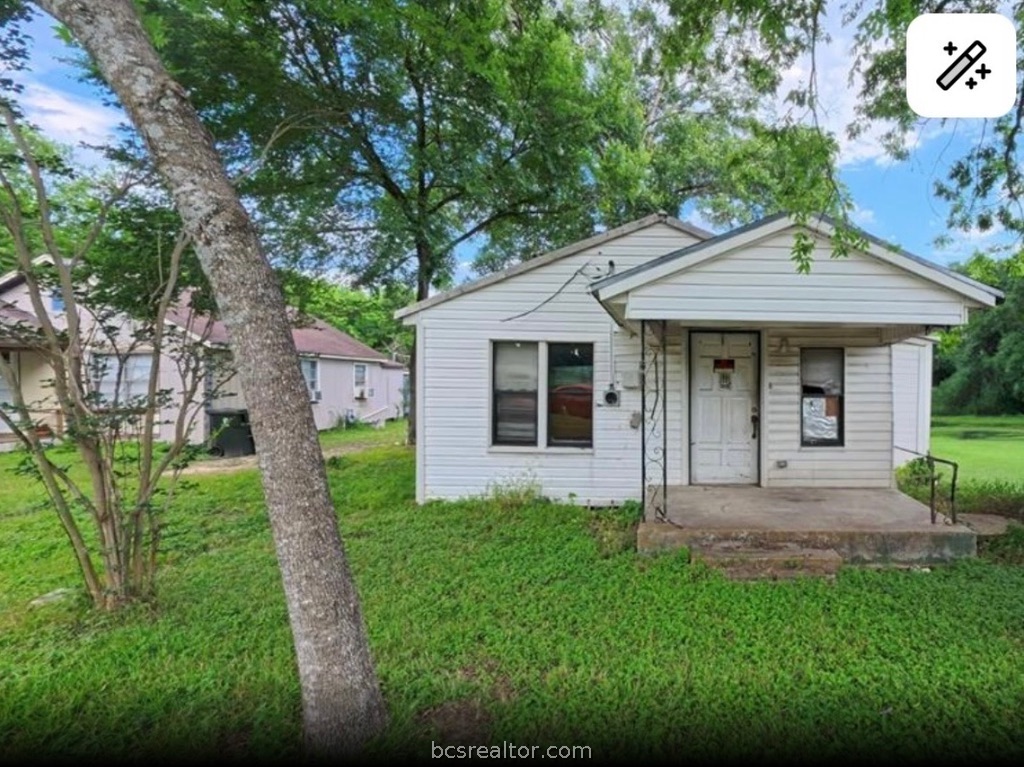1203 Boulevard Street Bryan, TX 77803 - Photo 2 of 16 a front view of a house with garden