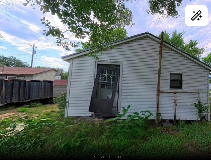 1203 Boulevard Street Bryan, TX 77803 - Photo 6 of 16 a view of a house with a yard