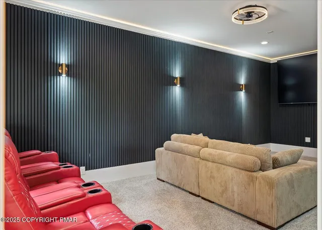 a bedroom with two beds and painting on the wall