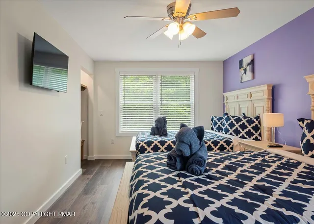 a patio with a table and chairs under an umbrella