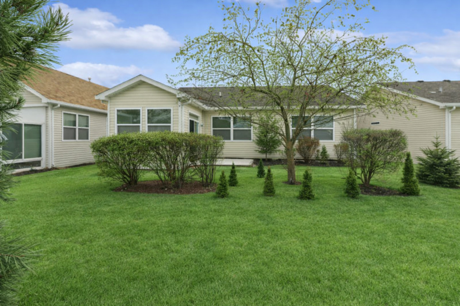696 Wellston Lane Romeoville, IL 60446 - Photo 19 of 20 a front view of a house with a yard and trees