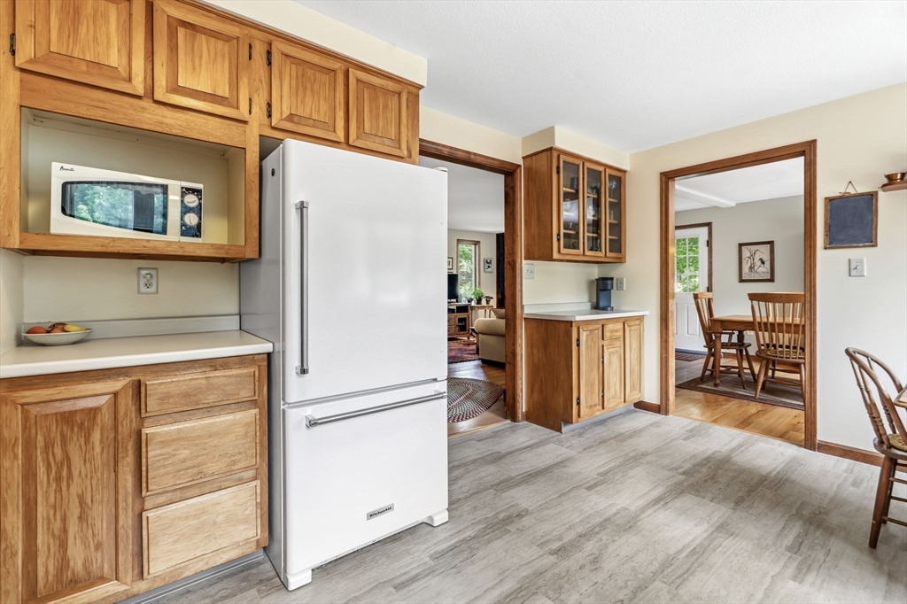 788 Burts Pit Road Northampton, MA 01062 - Photo 10 of 42 a kitchen with stainless steel appliances granite countertop a refrigerator and a stove top oven