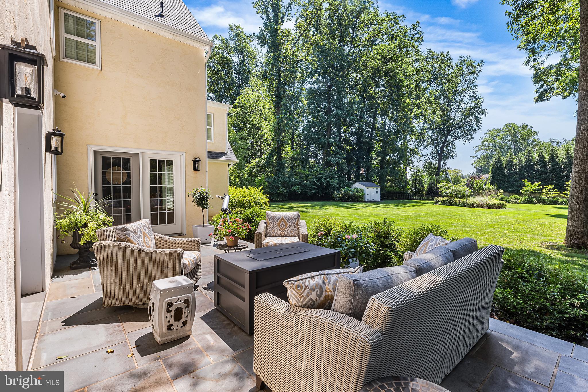 113 Deepdale Road Wayne, PA 19087 - Photo 24 of 68 a view of a patio with couches and a table and chairs with garden view