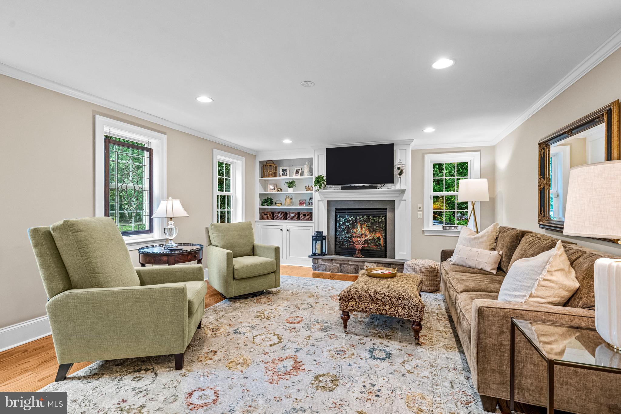 113 Deepdale Road Wayne, PA 19087 - Photo 26 of 68 a living room with furniture a flat screen tv and a fireplace