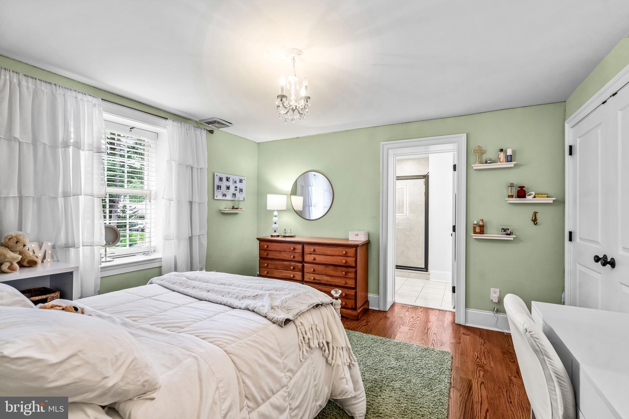 113 Deepdale Road Wayne, PA 19087 - Photo 44 of 68 a bedroom with a bed and a dresser with mirror