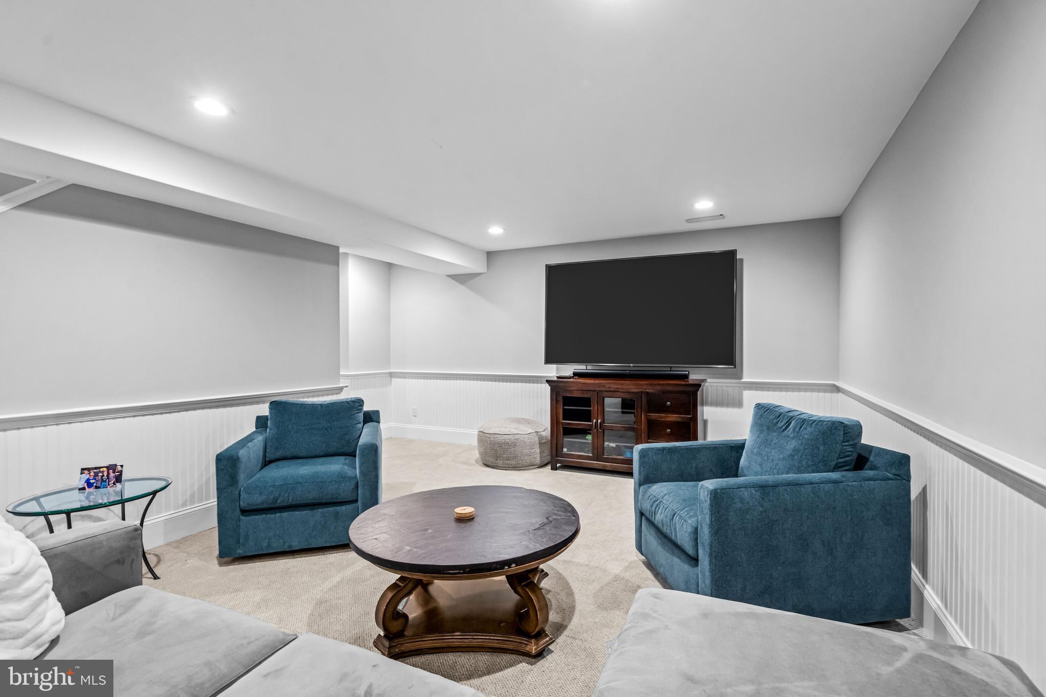 113 Deepdale Road Wayne, PA 19087 - Photo 52 of 68 a living room with furniture and a flat screen tv