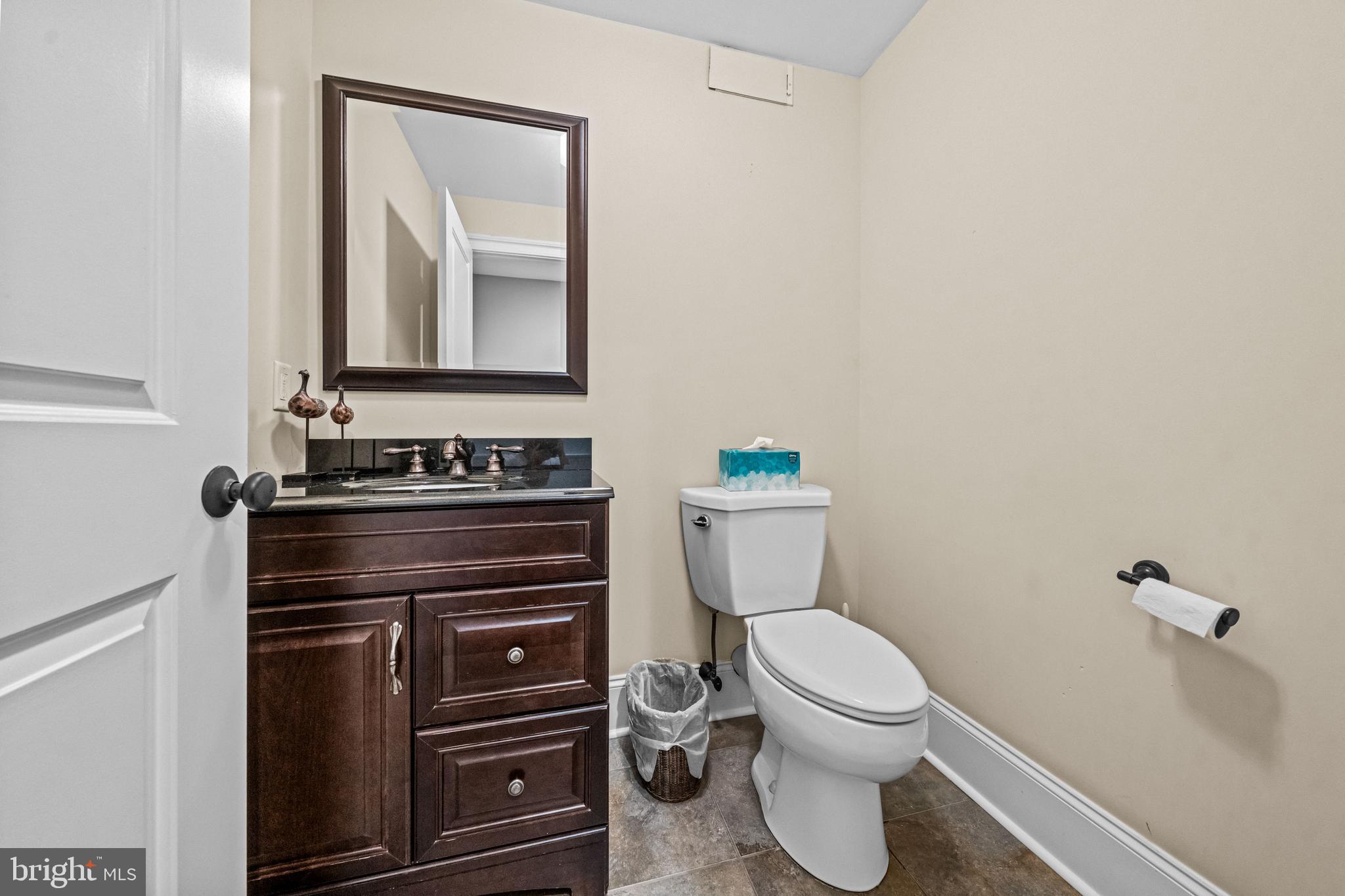 113 Deepdale Road Wayne, PA 19087 - Photo 58 of 68 a bathroom with a toilet a sink and mirror