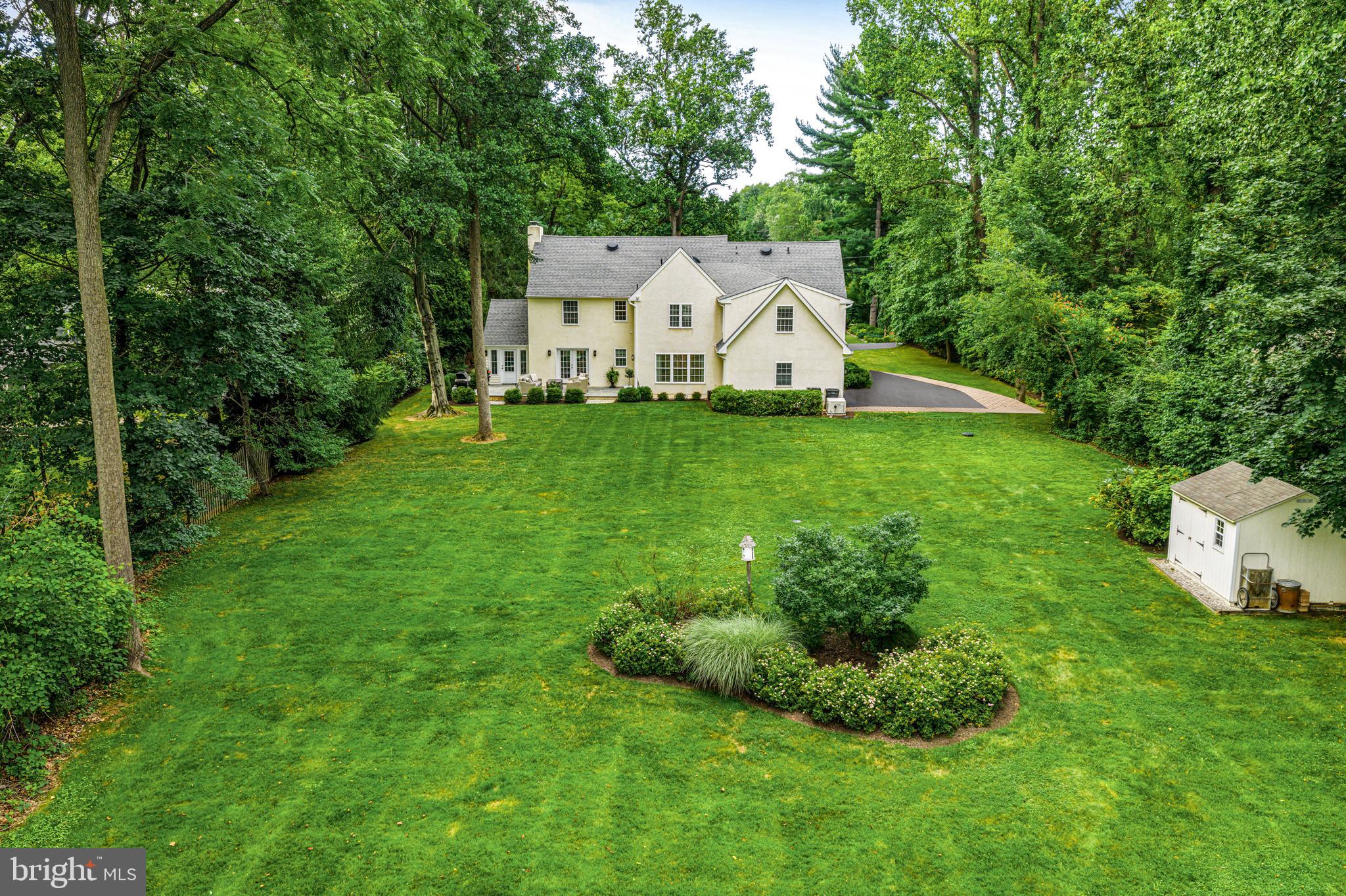 113 Deepdale Road Wayne, PA 19087 - Photo 65 of 68 a view of a white house with a big yard and large trees