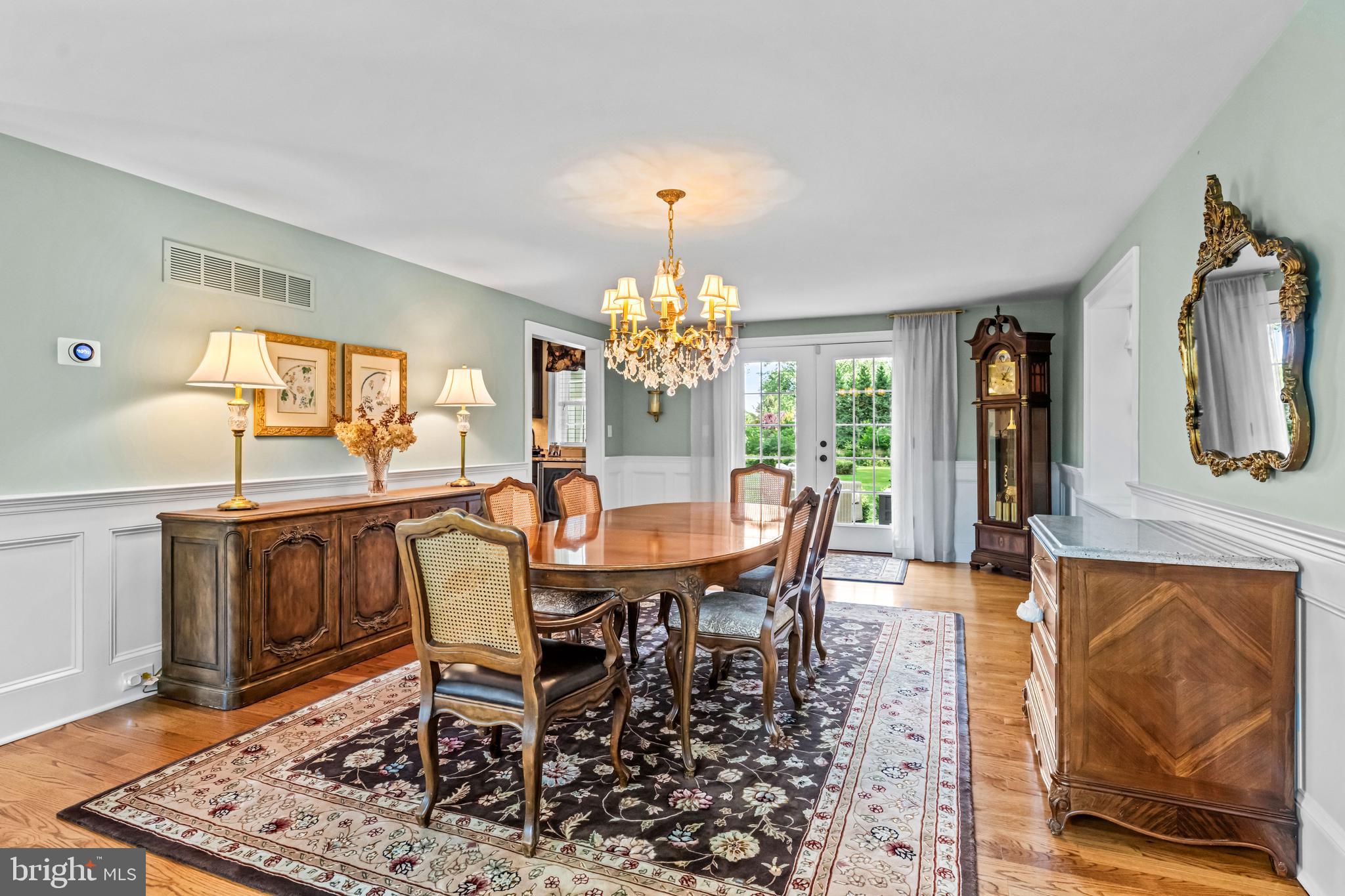 113 Deepdale Road Wayne, PA 19087 - Photo 9 of 68 a dining room with furniture a chandelier and wooden floor